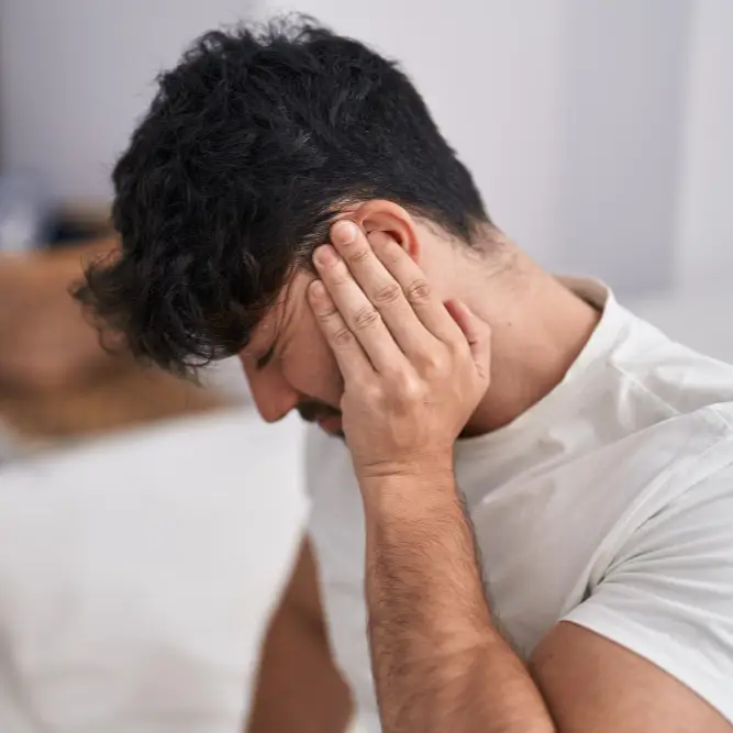 Pharmacy First Earache - Man holding ear in pain